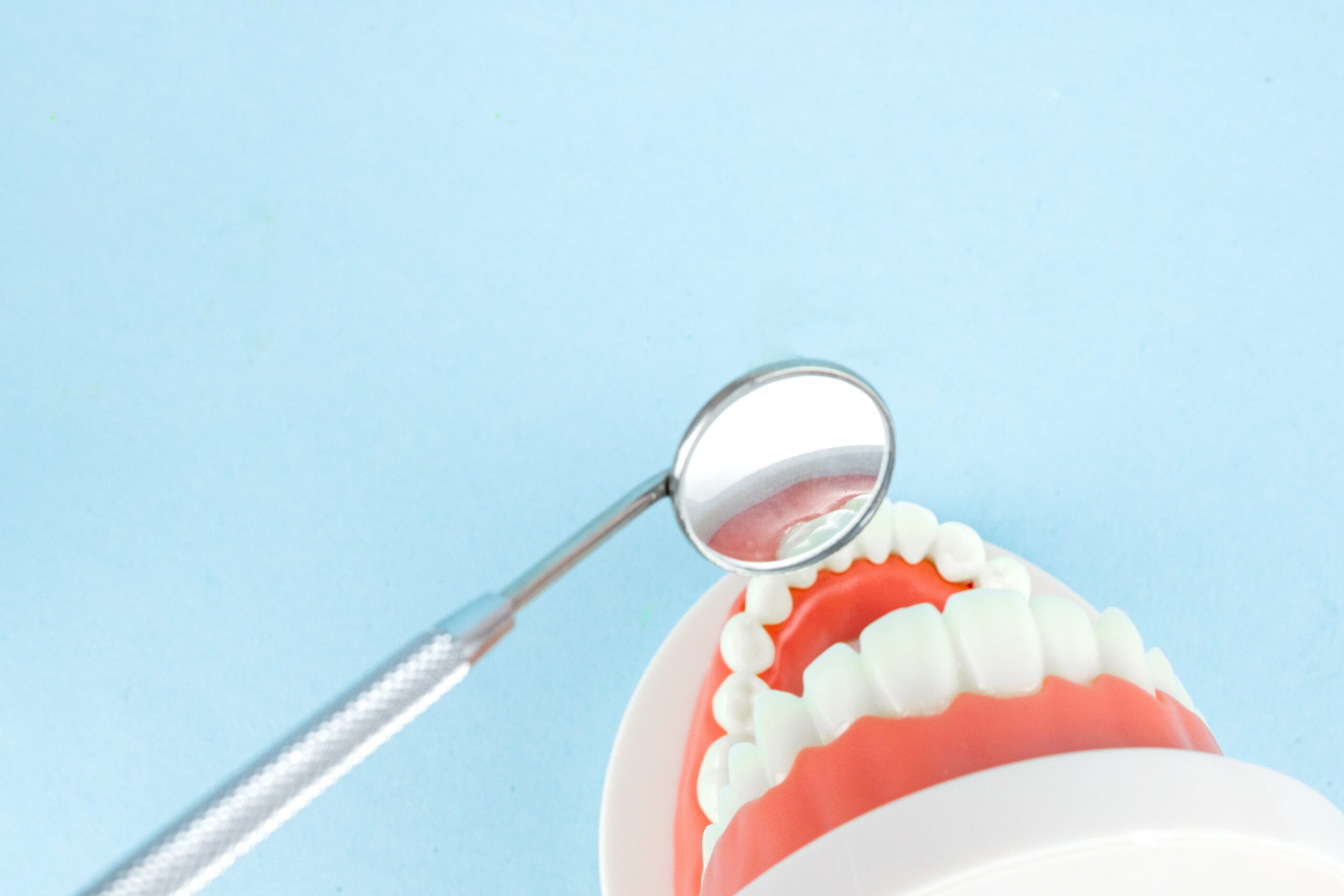 Dentist in Toronto examining a patient's teeth for a comprehensive full mouth rehabilitation procedure